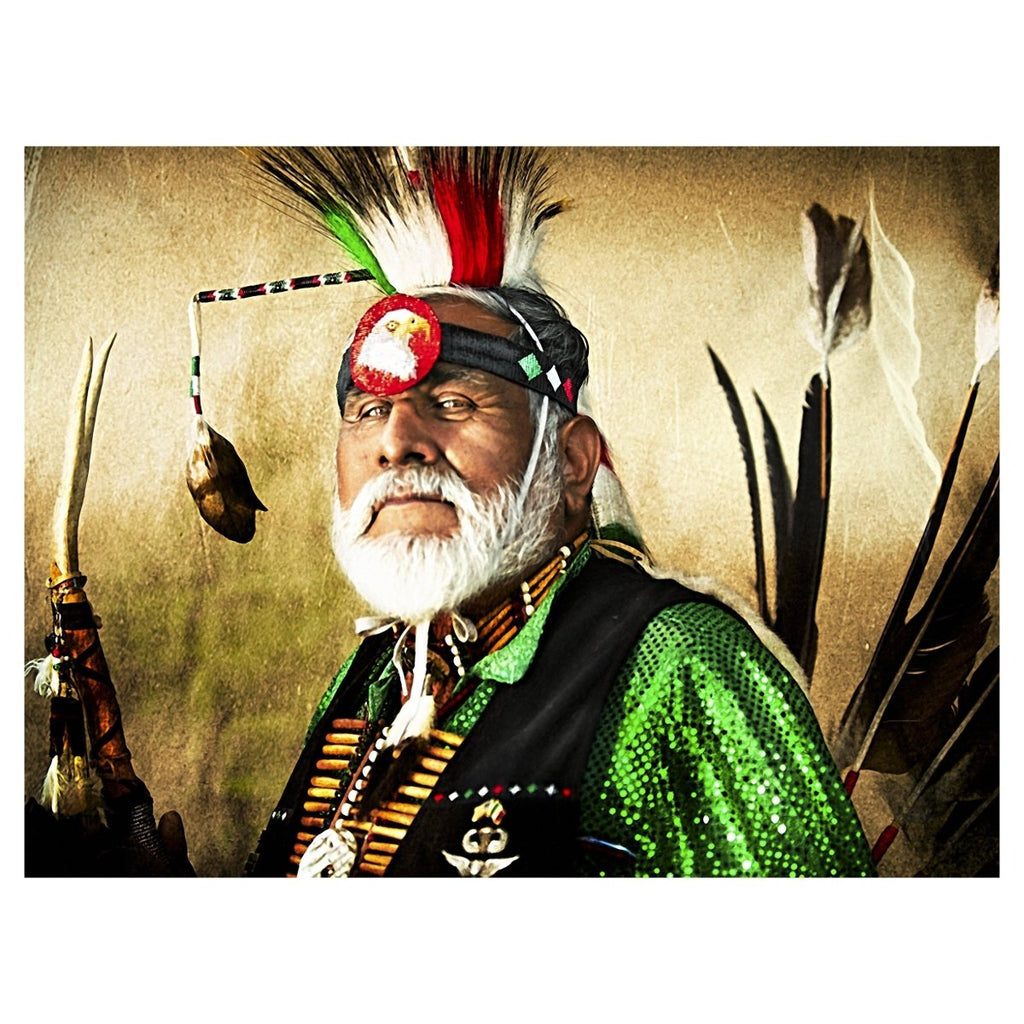 Photographing Native American Indians with Honor and Glory shown with a bright background, green shirt, feathers behind him.