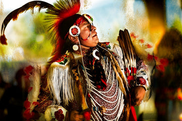 "Dance of the Prairie Chicken" - a photograph of a Native American dancer in traditional regalia by Michael W. Rutherford, capturing the essence of a sacred dance.