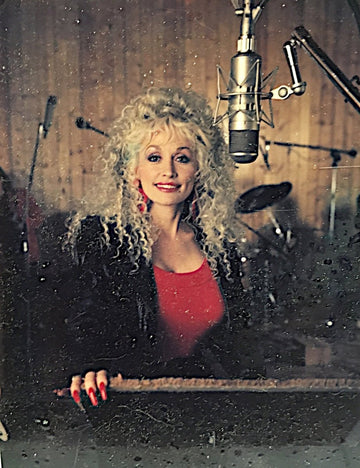 Dolly Parton in recording studio with snow-like filter, captured by Michael W. Rutherford.