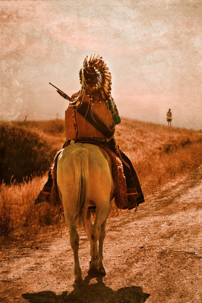 Sepia-toned photograph of a Native American warrior on horseback, titled 'Heading Home' by Michael W. Rutherford, embodying a dreamy, nostalgic journey.