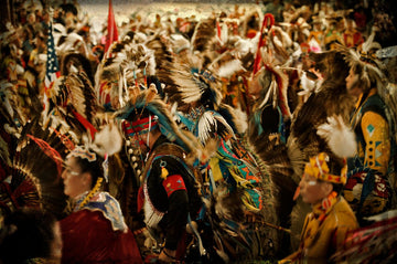 Native American powwow dancers in traditional regalia, vibrant cultural celebration