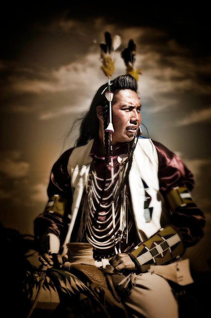 Depiction of a Nez Perce Indian man on horseback, dressed in elaborate traditional regalia, participating in a ceremony or powwow with a vignette look.