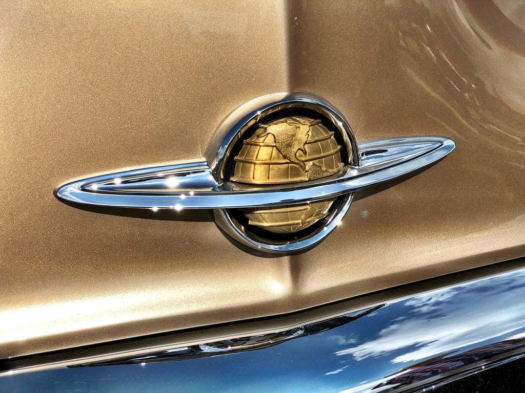 1941-51 Oldsmobile Globe emblem on gold car hood, chrome finish